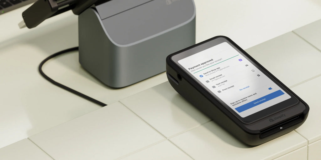 Smartphone with a POS system app on a white surface